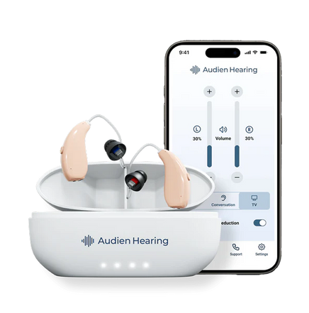 Audien Hearing ION series hearing aids in charging case with smartphone app showing volume and sound settings

